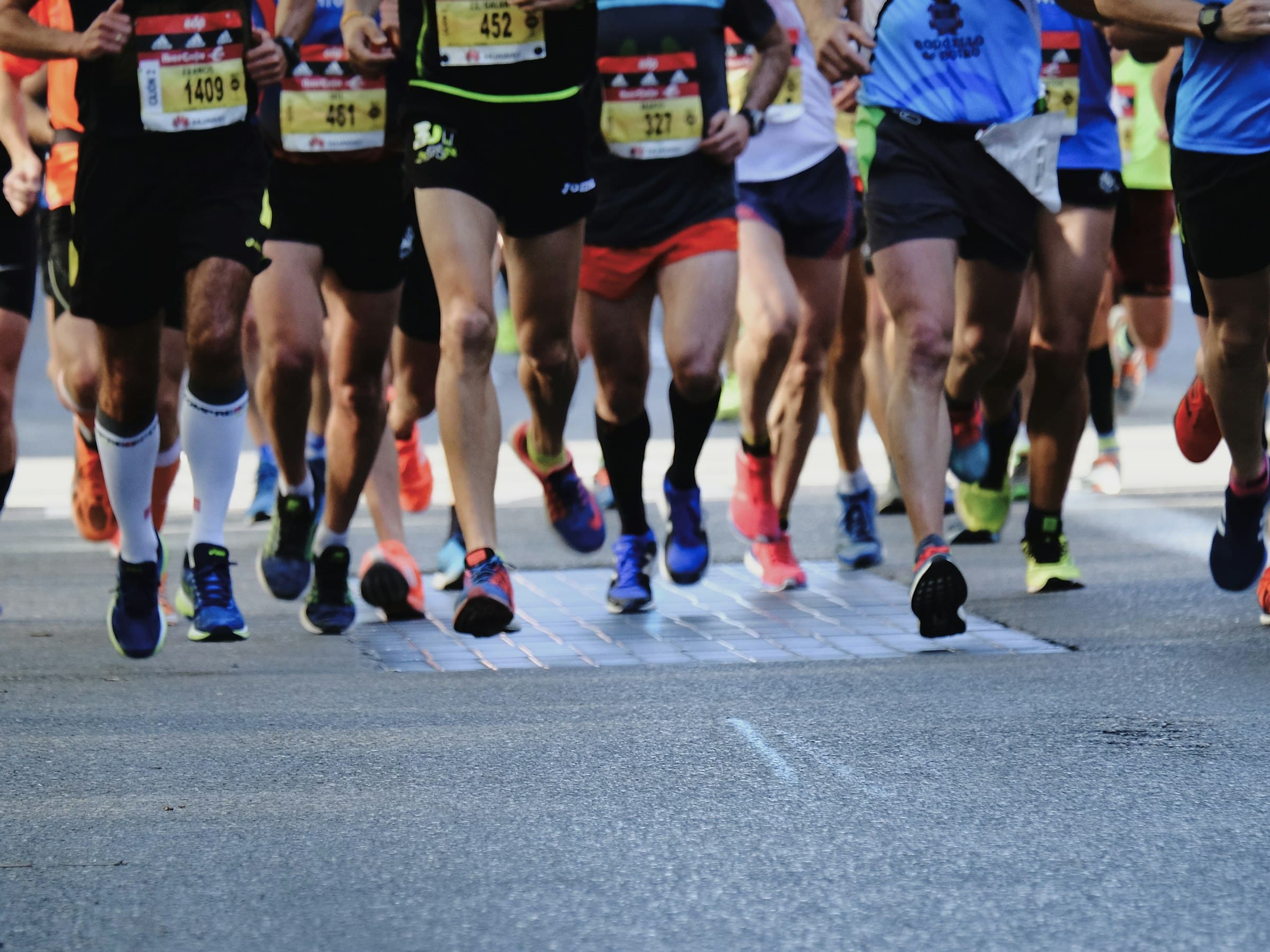 Runners on a road at golden hour